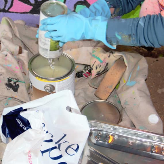 Erika Doyle mixing sealant for her mural, Nov 24, 2017
