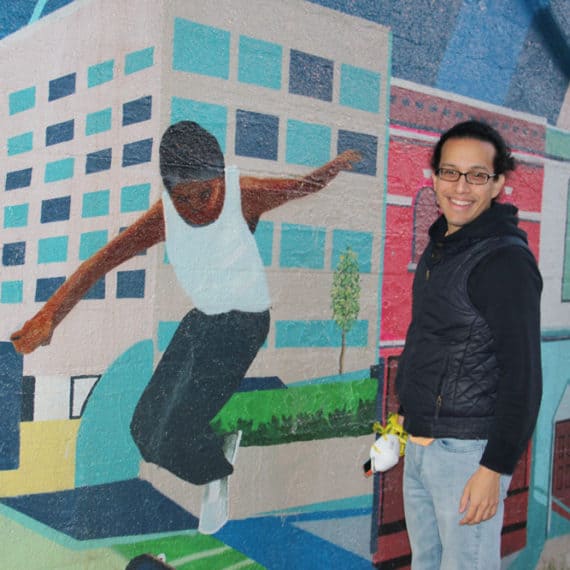 NAC team member Enrique Morales at Keith Pollok's mural