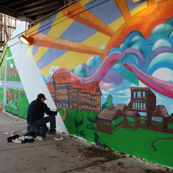 Ken Klopack helping to paint his son's mural