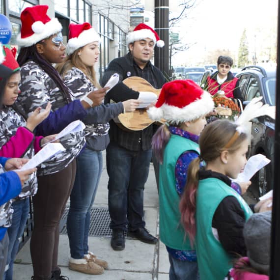Caroling by Girl Scouts and Dale Tippett Jr at City Newsstand 2016