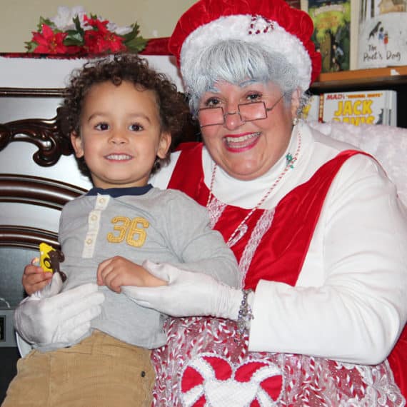 Mrs. Claus and boy at City Newsstand 2017